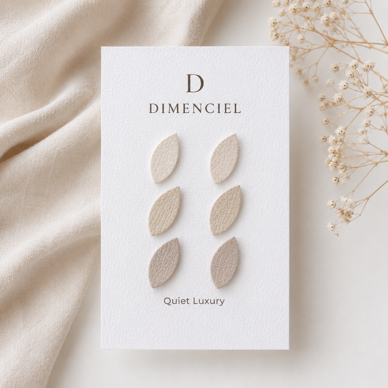 Quiet Luxury Leaf Ear Studs Set — three pairs in neutral tones on Dimenciel branded card