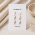 Quiet Luxury Leaf Ear Studs Set — three pairs in ivory, sand, and blush on Dimenciel branded card