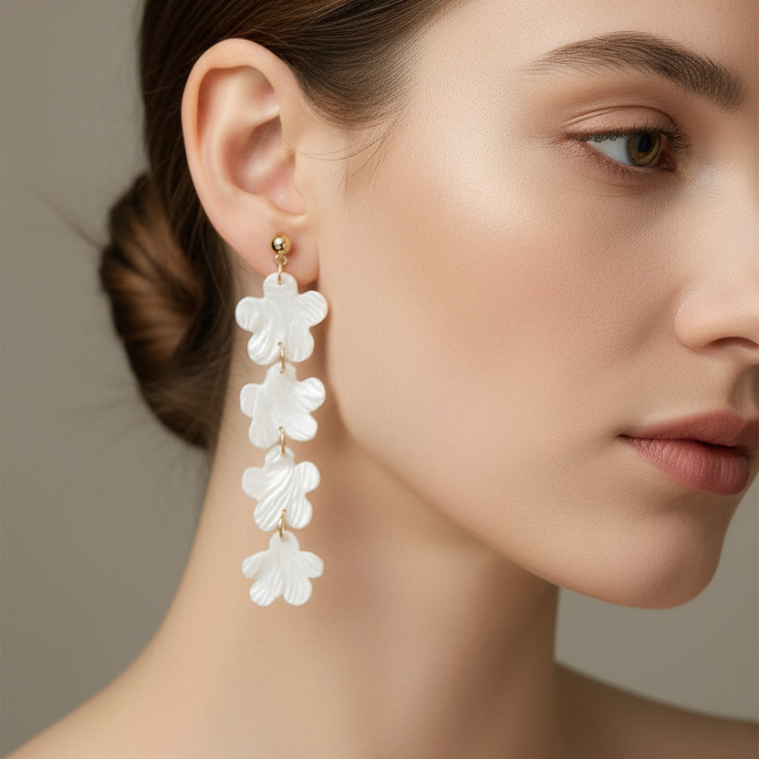 Model wearing delicate cascading flower earrings