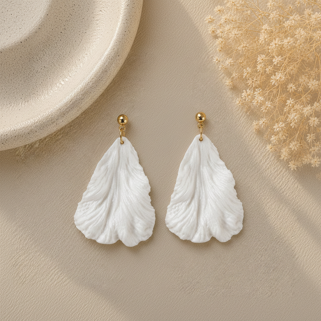 Pair of white triangle petal earrings